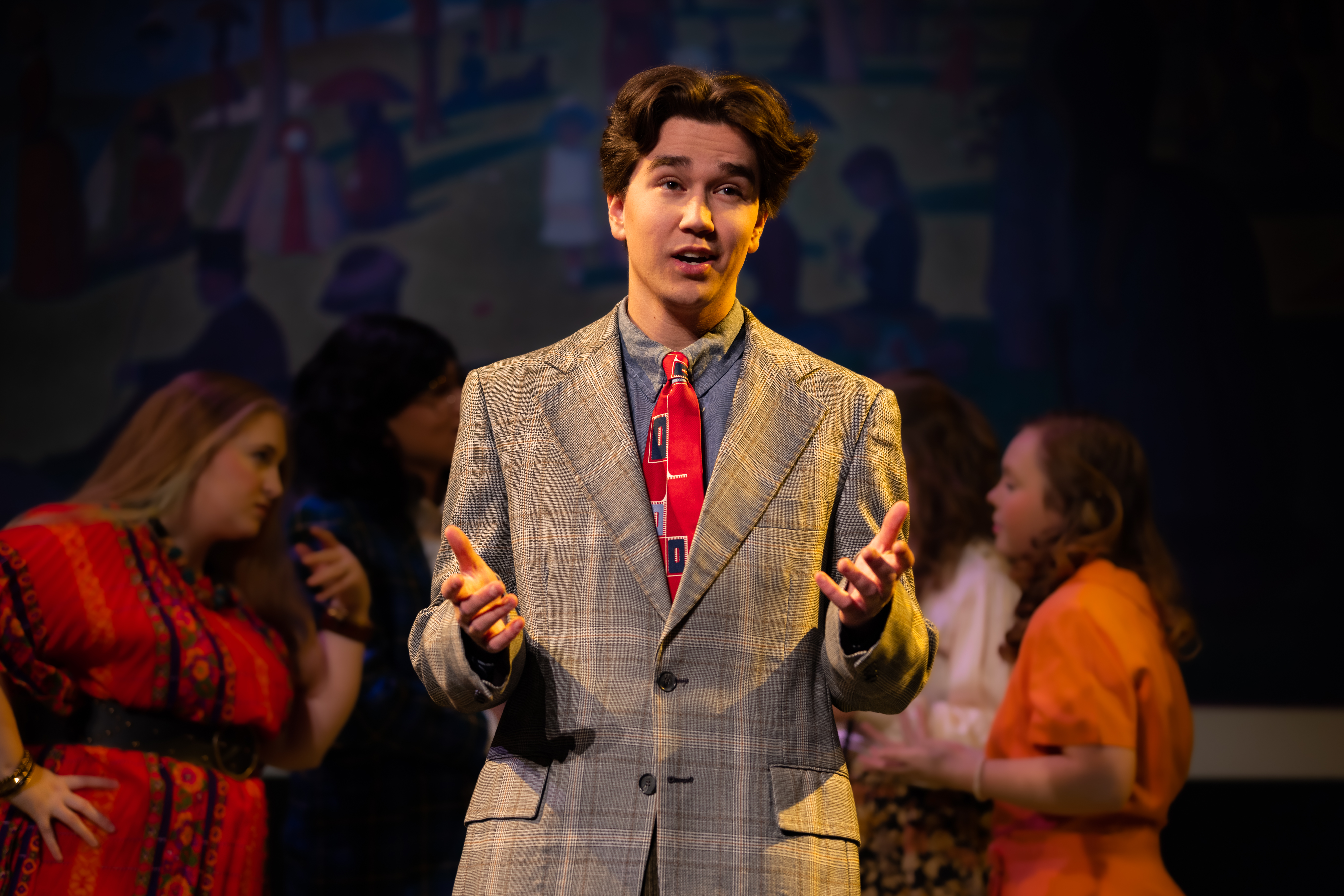 a student performing in the spring musical