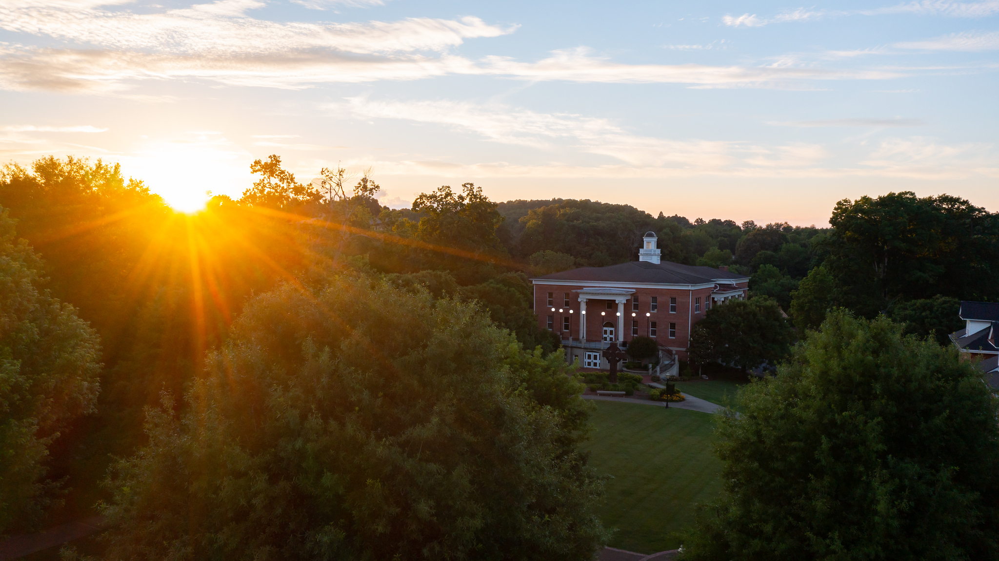 sunset behind Derthick Hall