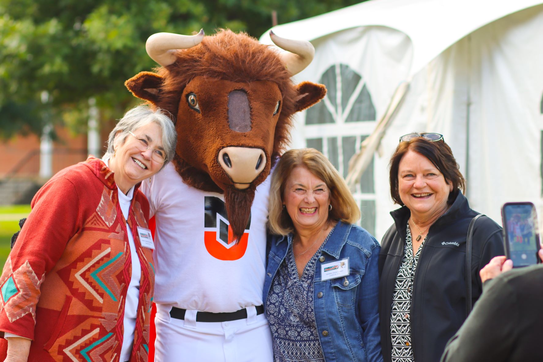 Milligan mascot with alumni at Homecoming
