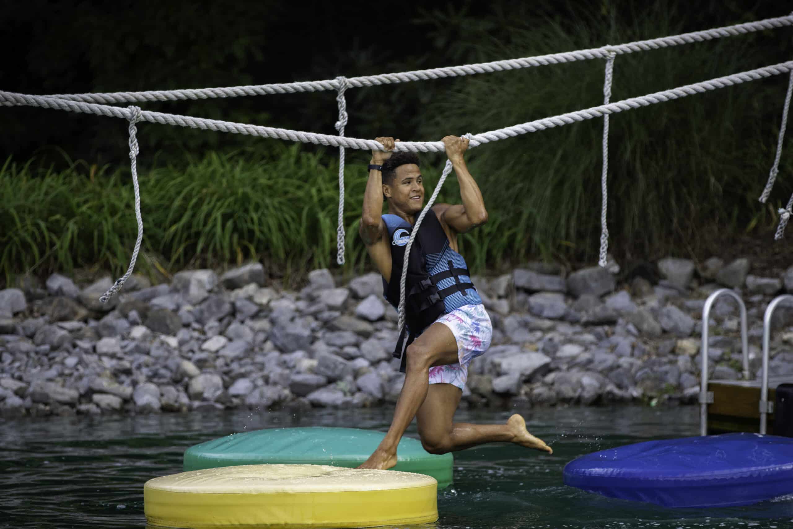 student on a rope course in the Doe River