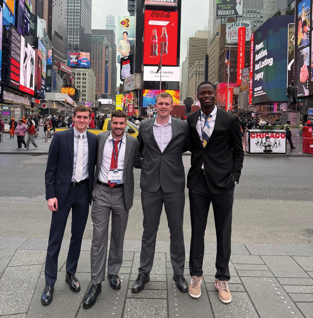 InvestmentClub_TimesSquare Investment Club students pose for a photo in Times Square during their trip to New York City.