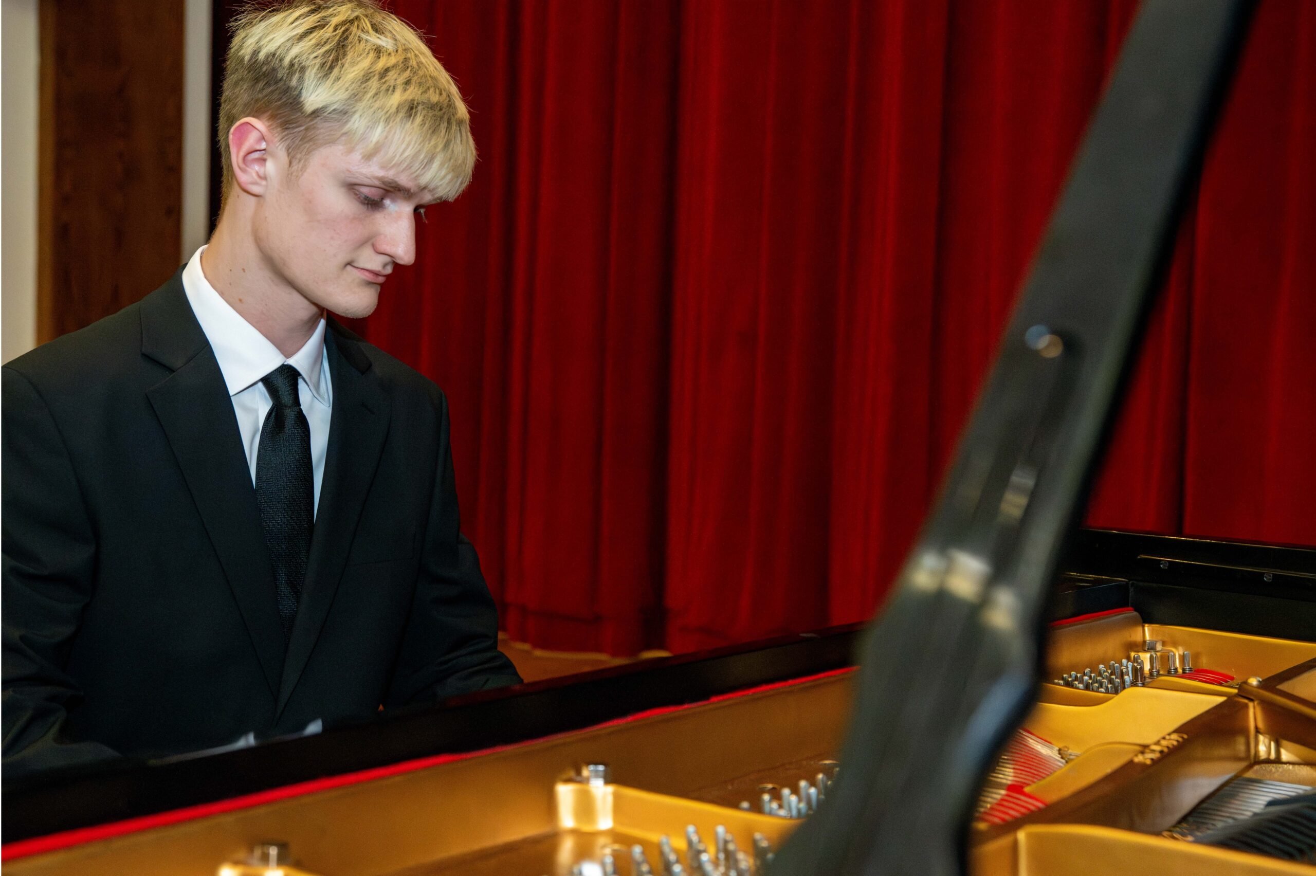 Max Brown playing the piano