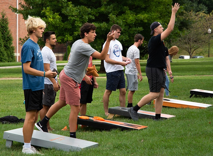 students play cornhole as a part of welcome week events