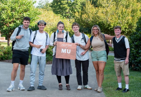 students pose for a photo on the Commons during the first day of classes