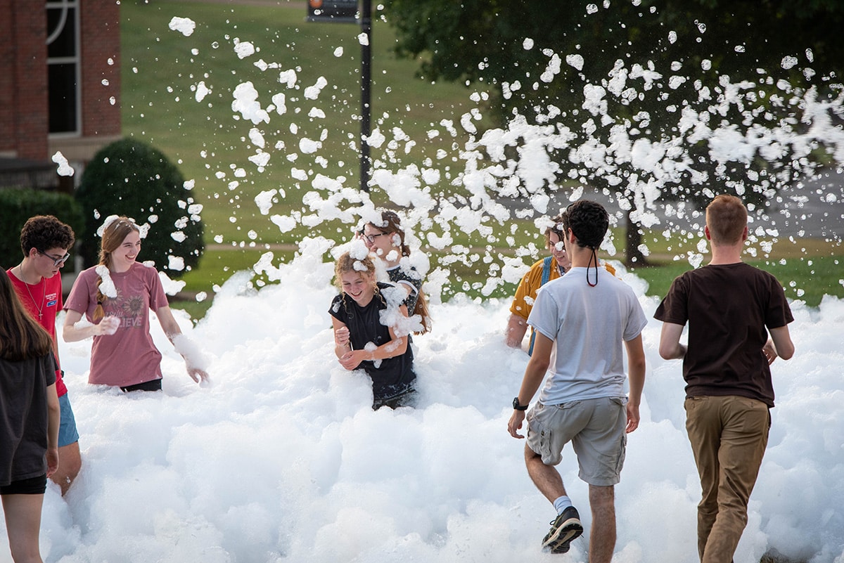 students participate in a foam party as part of welcome week activities
