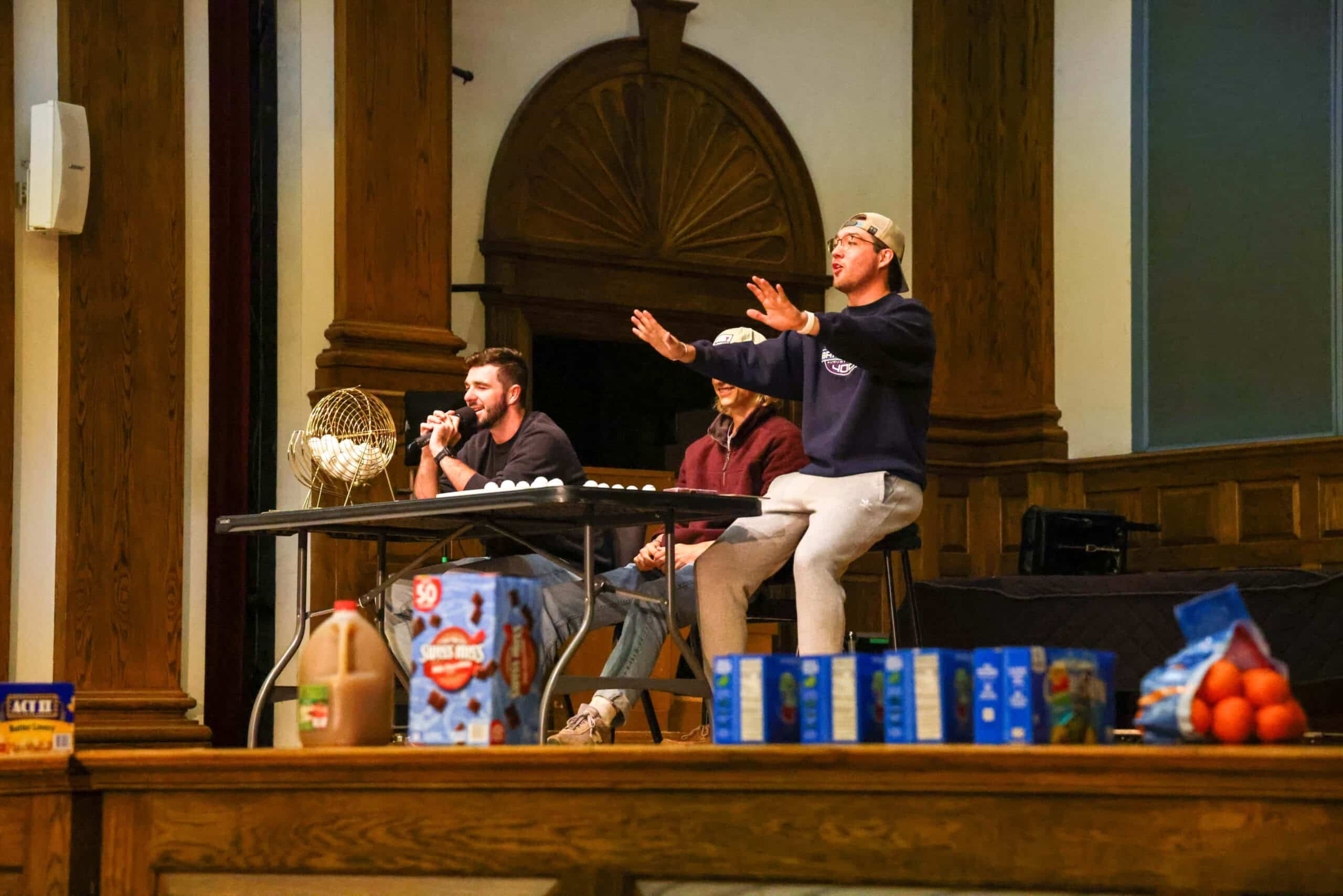 Students on stage playing grocery bingo