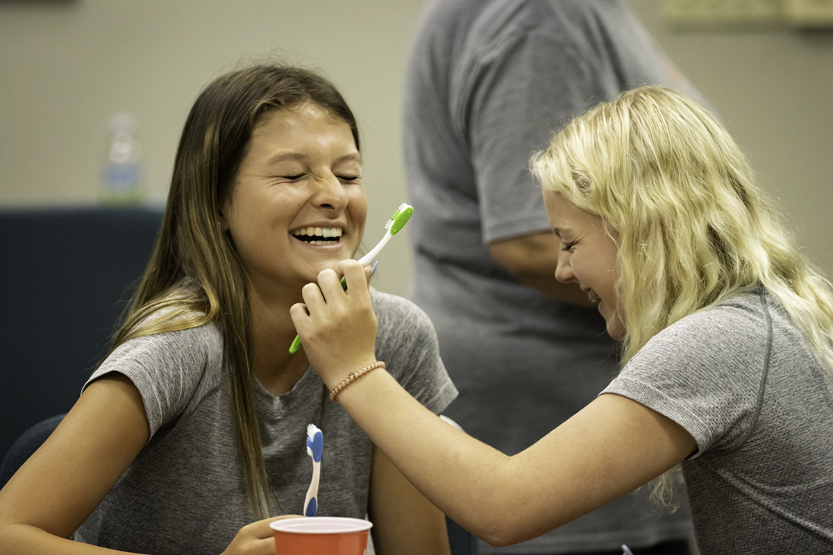 nursing_camp kids brush each others teeth during nursing camp