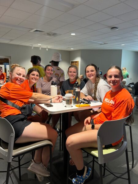 students inside smiling at campus event