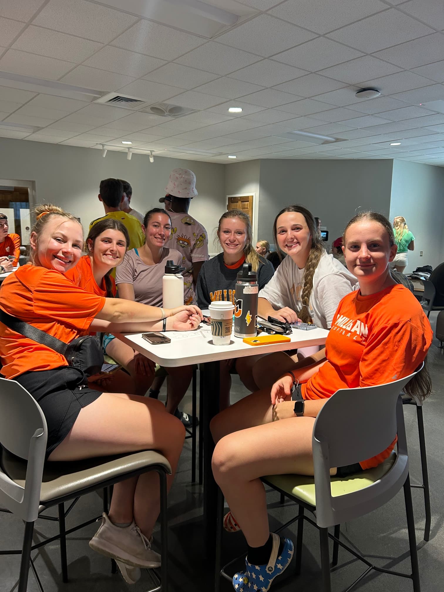 students inside smiling at campus event