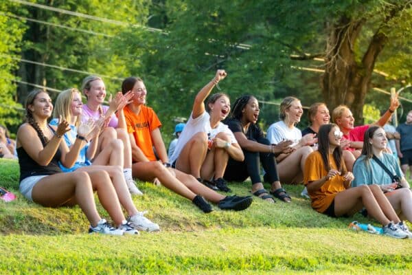 students cheering on at an event outside